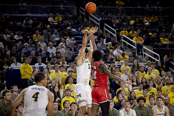 Nimari Burnett (4) and Olivier Nkamhoua (13)
