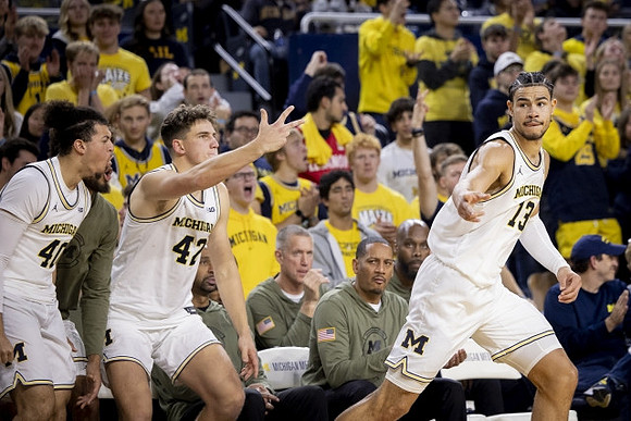 George Washington III (40), Will Tschetter (42), Howard Eisley, and Olivier Nkamhoua (13)