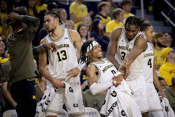 Jace Howard (25), Olivier Nkamhoua (13), Dug McDaniel (0), Tarris Reed Jr. (32), and Nimari Burnett (4)