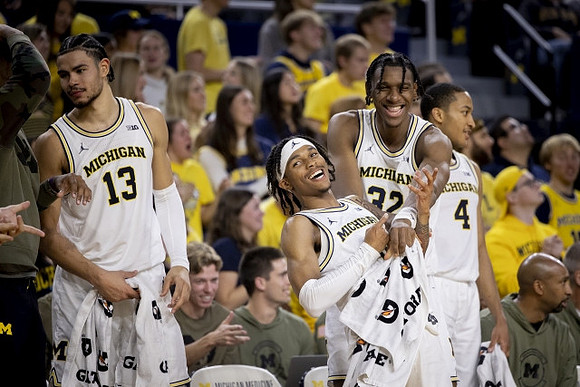 Olivier Nkamhoua (13), Dug McDaniel (0), Tarris Reed Jr. (32), and Nimari Burnett (4)