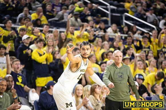 Olivier Nkamhoua (13) and Phil Martelli