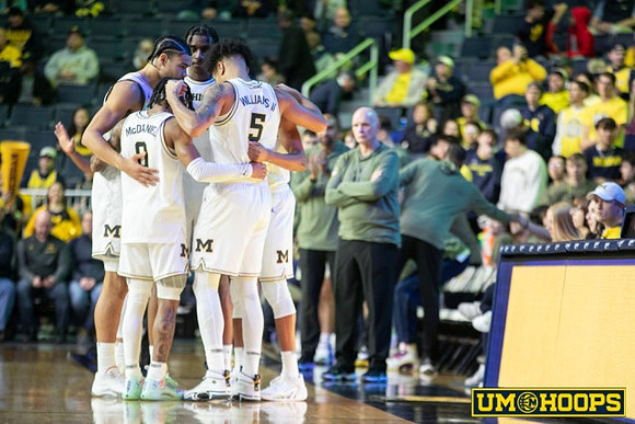 Olivier Nkamhoua (13), Dug McDaniel (0), Terrance Williams II (5), Tarris Reed Jr. (32), and Phil Martelli