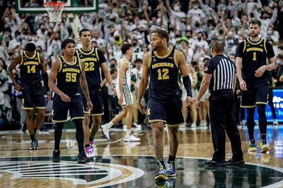 Moussa Diabate (14), Eli Brooks (55), Caleb Houstan (22), DeVante' Jones (12), and Hunter Dickinson (1)