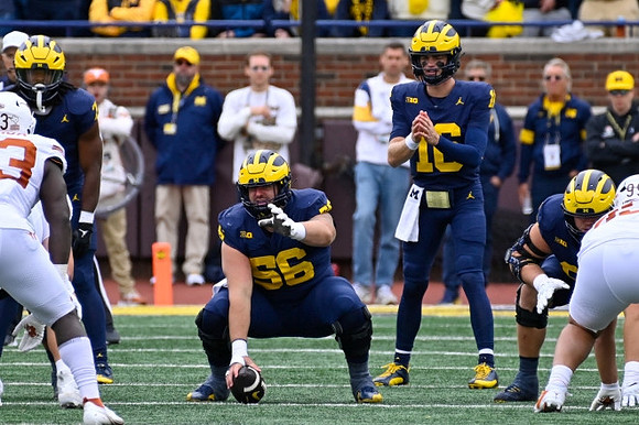 Donovan Edwards (7), Dominick Giudice (56), and Davis Warren (16)