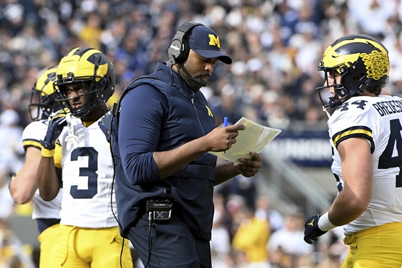 Fredrick Moore (3), Sherrone Moore, and Max Bredeson (44)