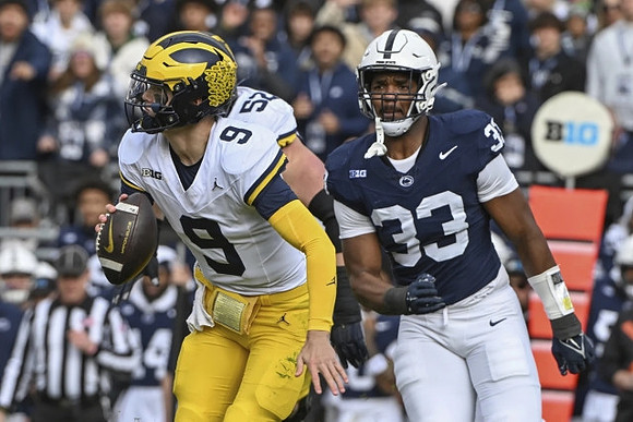 J.J. McCarthy (9) and Karsen Barnhart (52)
