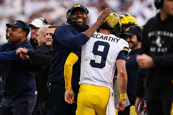 Mike Hart, Sherrone Moore, and J.J. McCarthy (9)