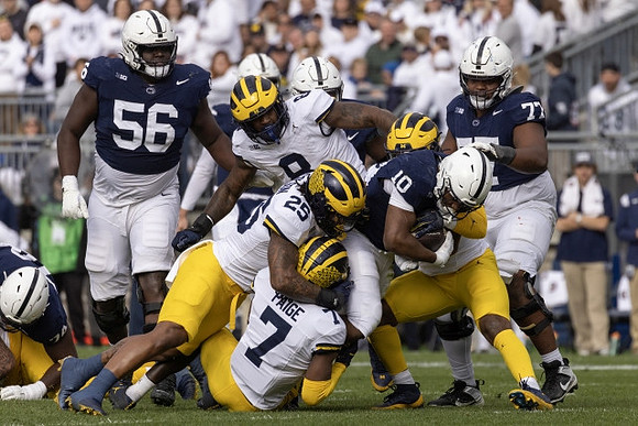 Makari Paige (7), Junior Colson (25), and Derrick Moore (8)
