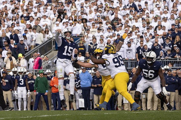Mason Graham (55) and Cam Goode (99)