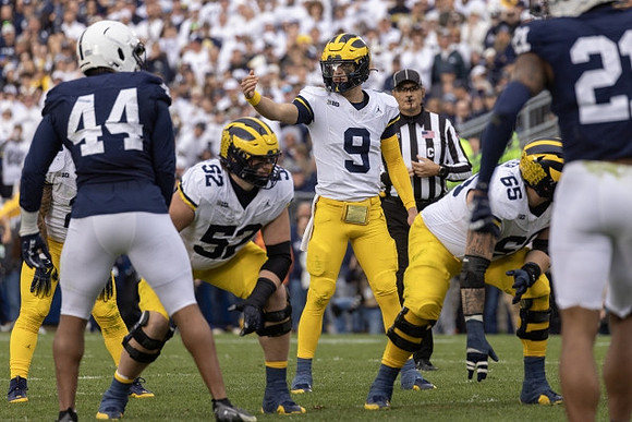 Karsen Barnhart (52), J.J. McCarthy (9), and Zak Zinter (65)