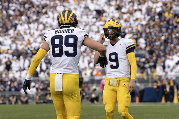 AJ Barner (89) and J.J. McCarthy (9)