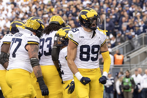 Trevor Keegan (77), Trente Jones (93), Blake Corum (2), and AJ Barner (89)