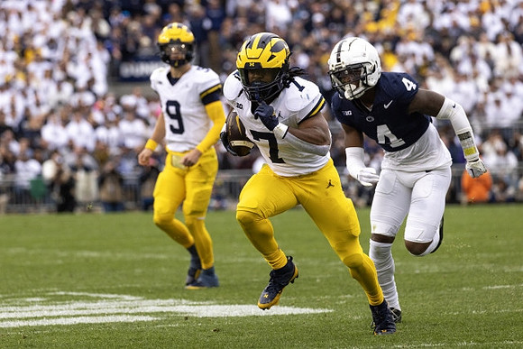 J.J. McCarthy (9) and Donovan Edwards (7)