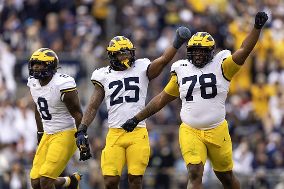 Derrick Moore (8), Junior Colson (25), and Kenneth Grant (78)
