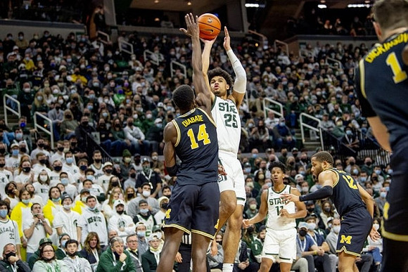 Moussa Diabate (14), DeVante' Jones (12), and Hunter Dickinson (1)
