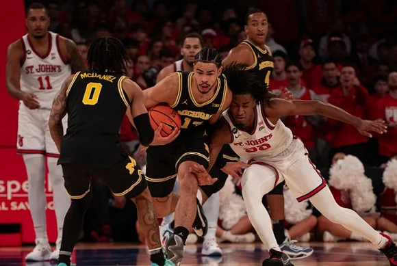 Dug McDaniel (0), Olivier Nkamhoua (13), and Nimari Burnett (4)