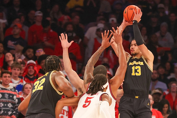 Tarris Reed Jr. (32) and Olivier Nkamhoua (13)