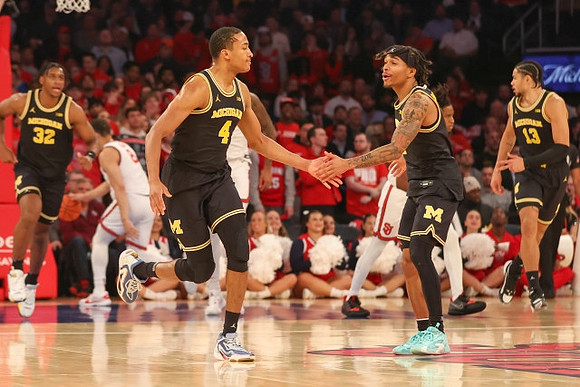 Tarris Reed Jr. (32), Nimari Burnett (4), Dug McDaniel (0), and Olivier Nkamhoua (13)