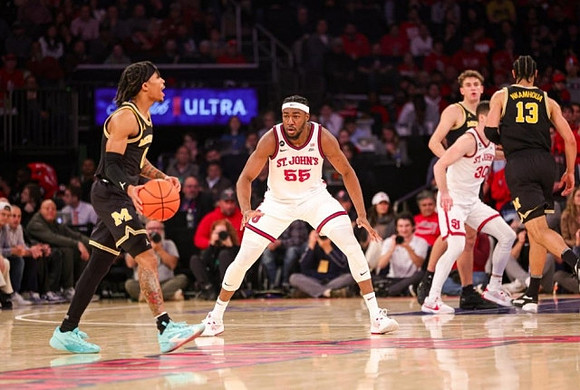 Dug McDaniel (0), Olivier Nkamhoua (13), and Will Tschetter (42)