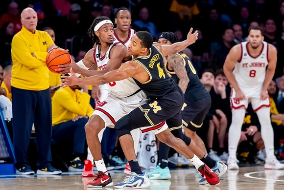 Phil Martelli, Nimari Burnett (4), and Dug McDaniel (0)