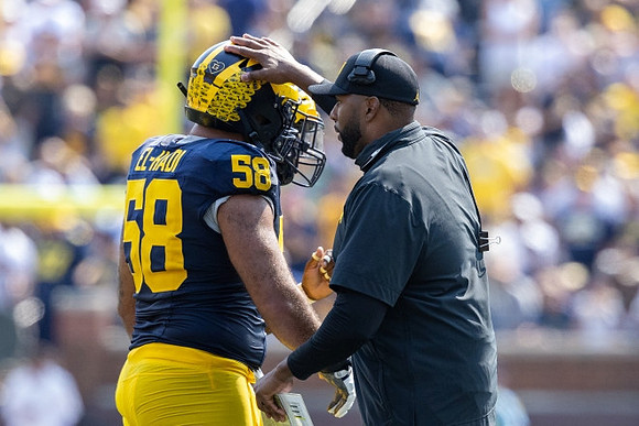 Giovanni El-Hadi (58) and Sherrone Moore