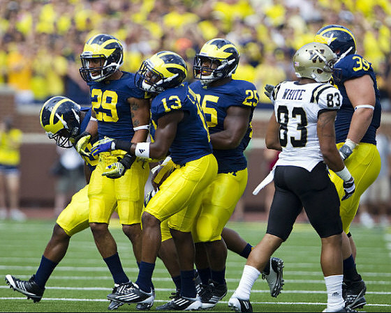 Troy Woolfolk (29), Carvin Johnson (13), Kenny Demens (25), and Will Heininger (39)