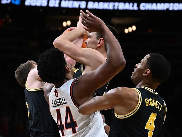 Will Tschetter (42), Vladislav Goldin (50), and Nimari Burnett (4)