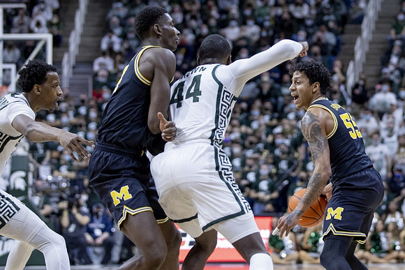 Moussa Diabate (14) and Eli Brooks (55)
