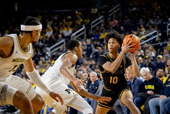 Olivier Nkamhoua (13) and Nimari Burnett (4)