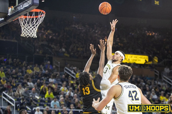 Olivier Nkamhoua (13) and Will Tschetter (42)