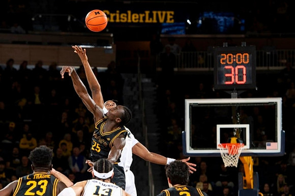 Tarris Reed Jr. (32) and Olivier Nkamhoua (13)