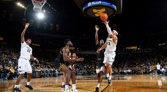 Tarris Reed Jr. (32) and Olivier Nkamhoua (13)