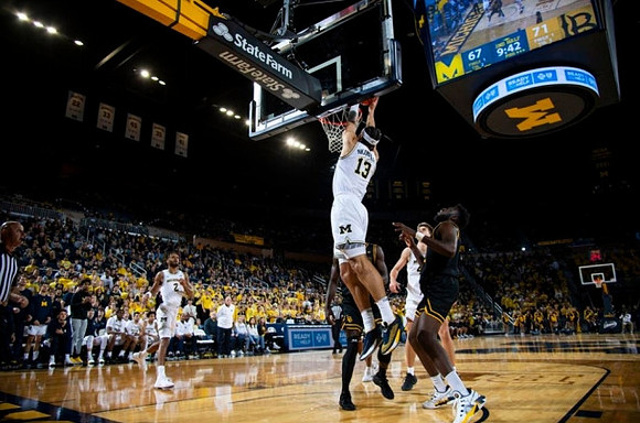 Olivier Nkamhoua (13), Tray Jackson (2), and Will Tschetter (42)