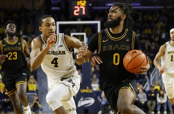 Nimari Burnett (4) and Olivier Nkamhoua (13)