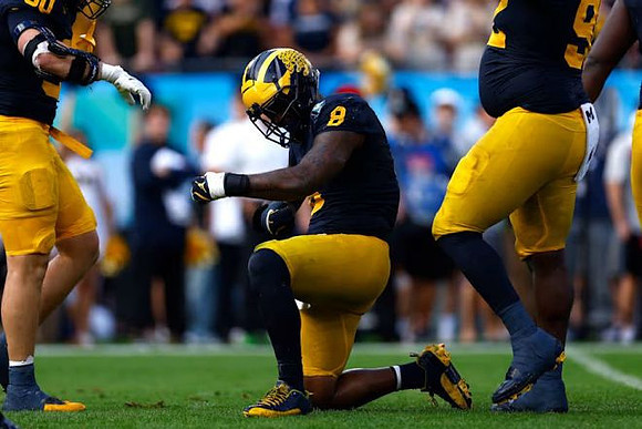 Jimmy Rolder (30), Derrick Moore (8), and Ike Iwunnah (92)