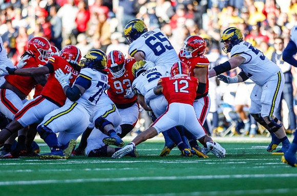 Myles Hinton (78), Blake Corum (2), Zak Zinter (65), and Karsen Barnhart (52)