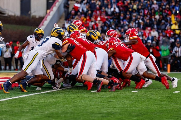 Ernest Hausmann (15), Derrick Moore (8), and Jaylen Harrell (32)