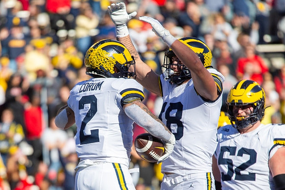 Blake Corum (2), Colston Loveland (18), and Karsen Barnhart (52)
