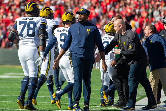 Myles Hinton (78), J.J. McCarthy (9), Sherrone Moore, Blake Corum (2), and Ben Herbert