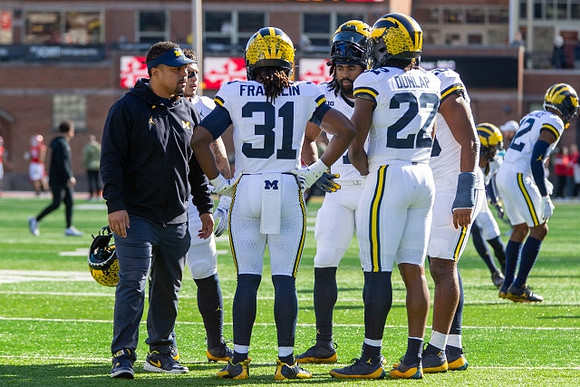 Mike Hart, Leon Franklin (31), Donovan Edwards (7), and Tavierre Dunlap (22)