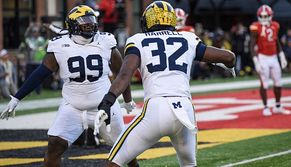 Cam Goode (99) and Jaylen Harrell (32)
