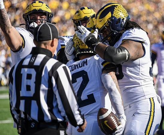 Colston Loveland (18), Blake Corum (2), and Trente Jones (93)