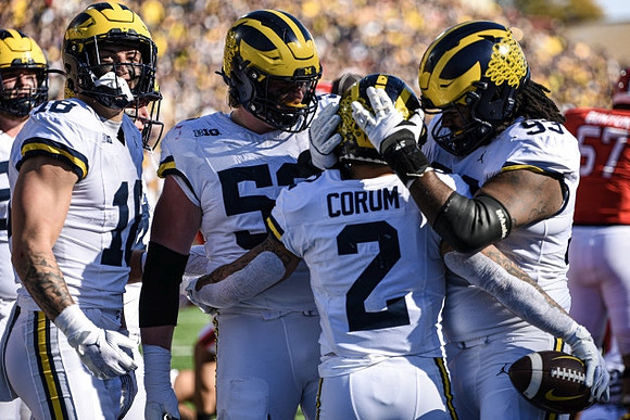 Colston Loveland (18), Karsen Barnhart (52), Blake Corum (2), and Trente Jones (93)