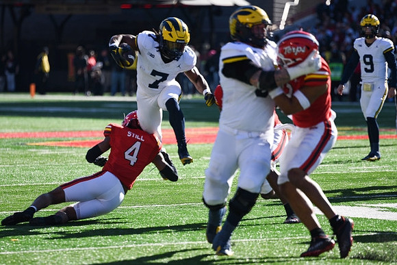 Donovan Edwards (7) and J.J. McCarthy (9)