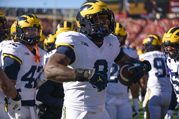 TJ Guy (42) and Derrick Moore (8)