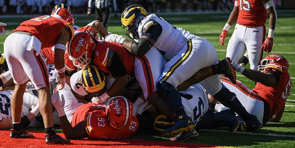 Blake Corum (2) and Myles Hinton (78)