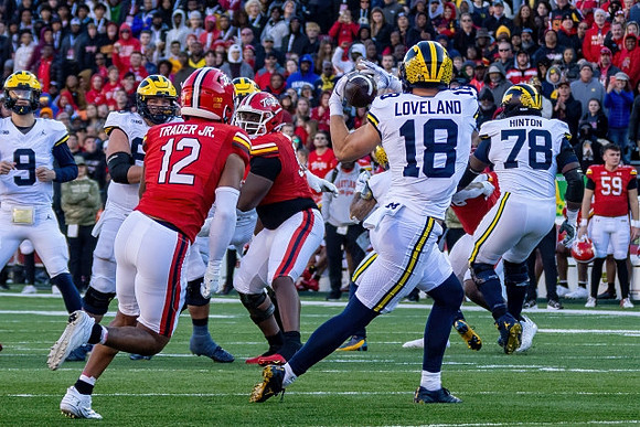 J.J. McCarthy (9), Colston Loveland (18), and Myles Hinton (78)