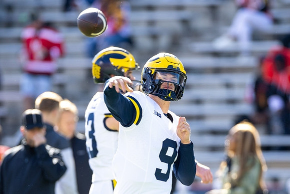 J.J. McCarthy (9) and Jack Tuttle (13)