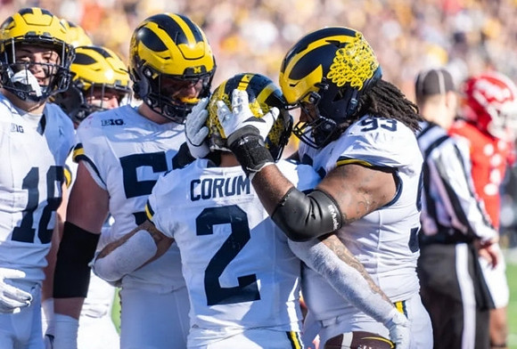 Colston Loveland (18), Karsen Barnhart (52), Blake Corum (2), and Trente Jones (93)