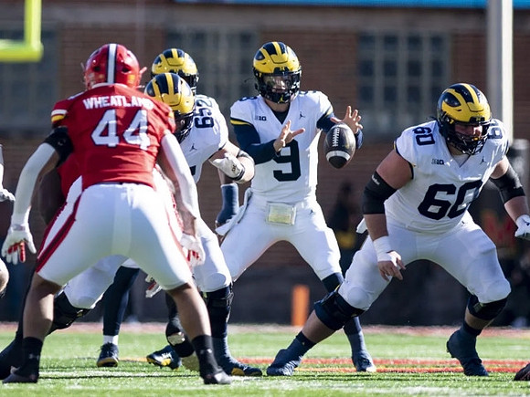 Zak Zinter (65), Kalel Mullings (20), J.J. McCarthy (9), and Drake Nugent (60)
